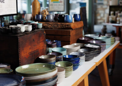 Waxman ceramic dinnerware in retail display.